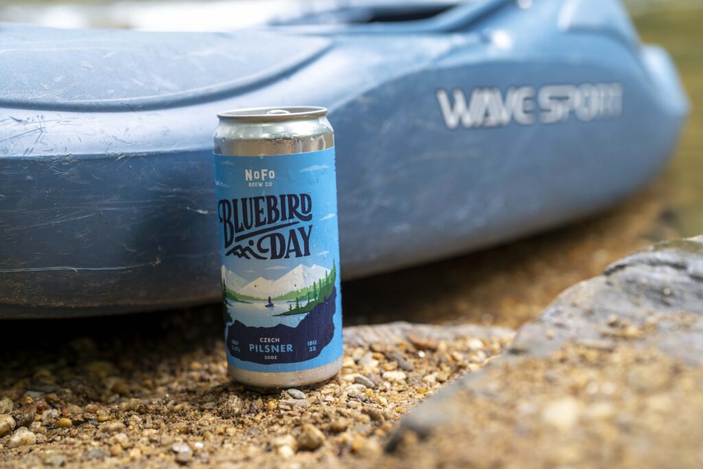 Blue Kayak with Bluebird Day Pilsner